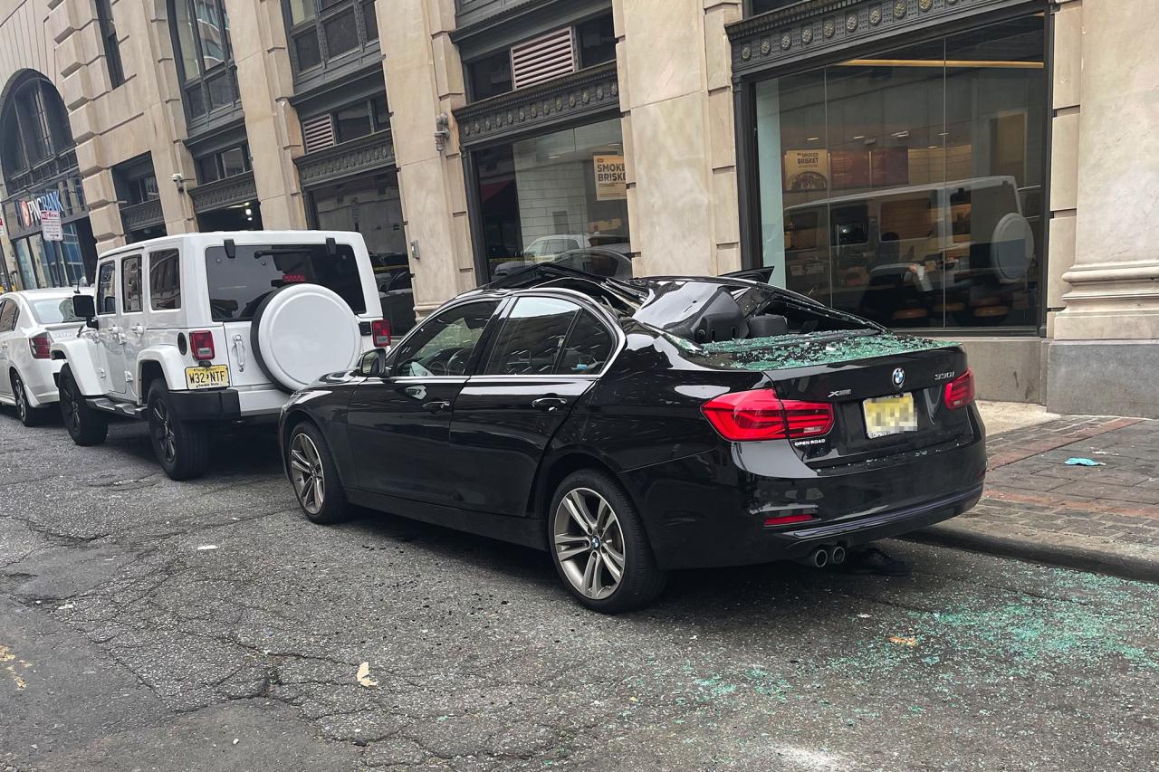 A BMW that broke the fall of a man who fell nine stories in Jersey City.